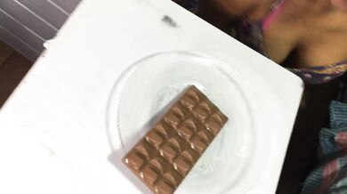 Stepdaughter eating chocolate with cum