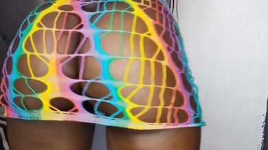 Big ebony milf shows bug oiled ass in rainbow lingerie