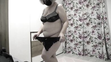 Mature bbw milf tries on different panties in front of a stranger on webcam.