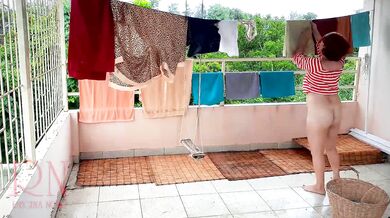 Naked laundry. The maid is drying clothes in the laundry.
