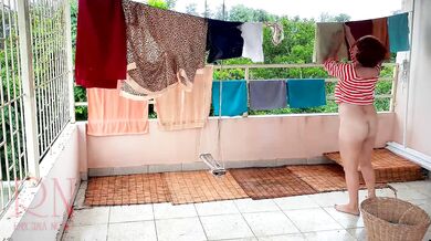 Naked laundry. The maid is drying clothes in the laundry.